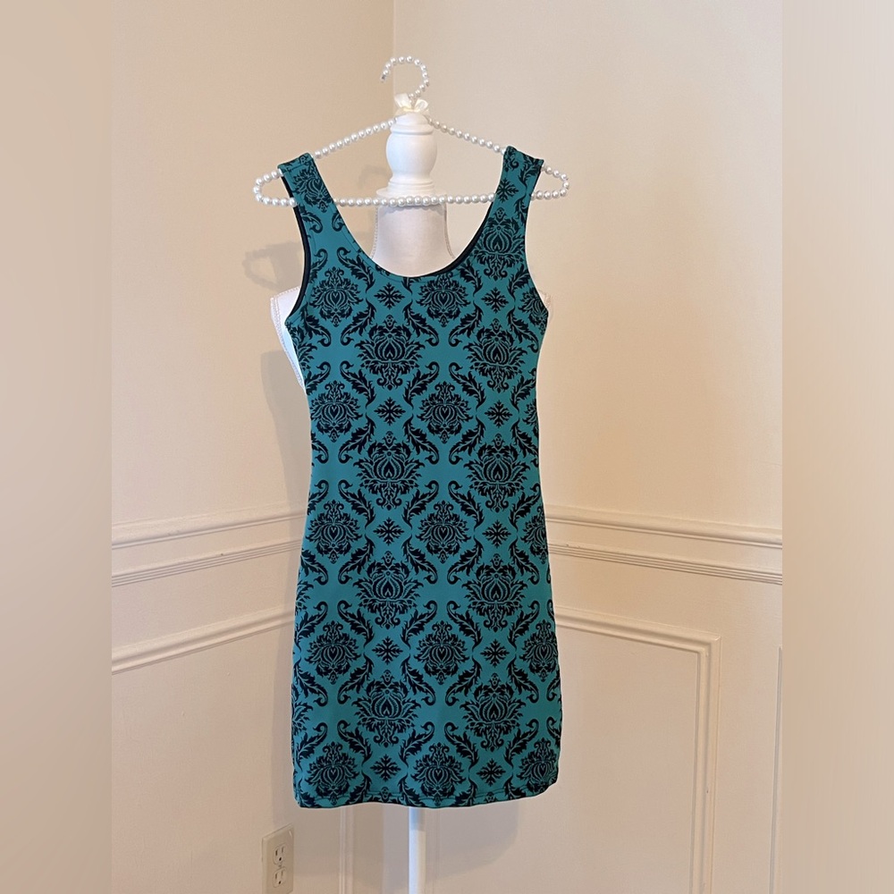 Carolina Green Mini Dress with black paisley pattern cutout lower back
